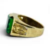 Vintage Mexican biker brass ring with green faceted glass stone and Our Lady of Guadalupe shoulders