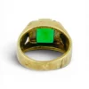 Vintage Mexican biker brass ring with green faceted glass stone and Our Lady of Guadalupe shoulders