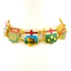Vintage Canada souvenir bracelet with colorful enameled provincial shield links and gold plated finish