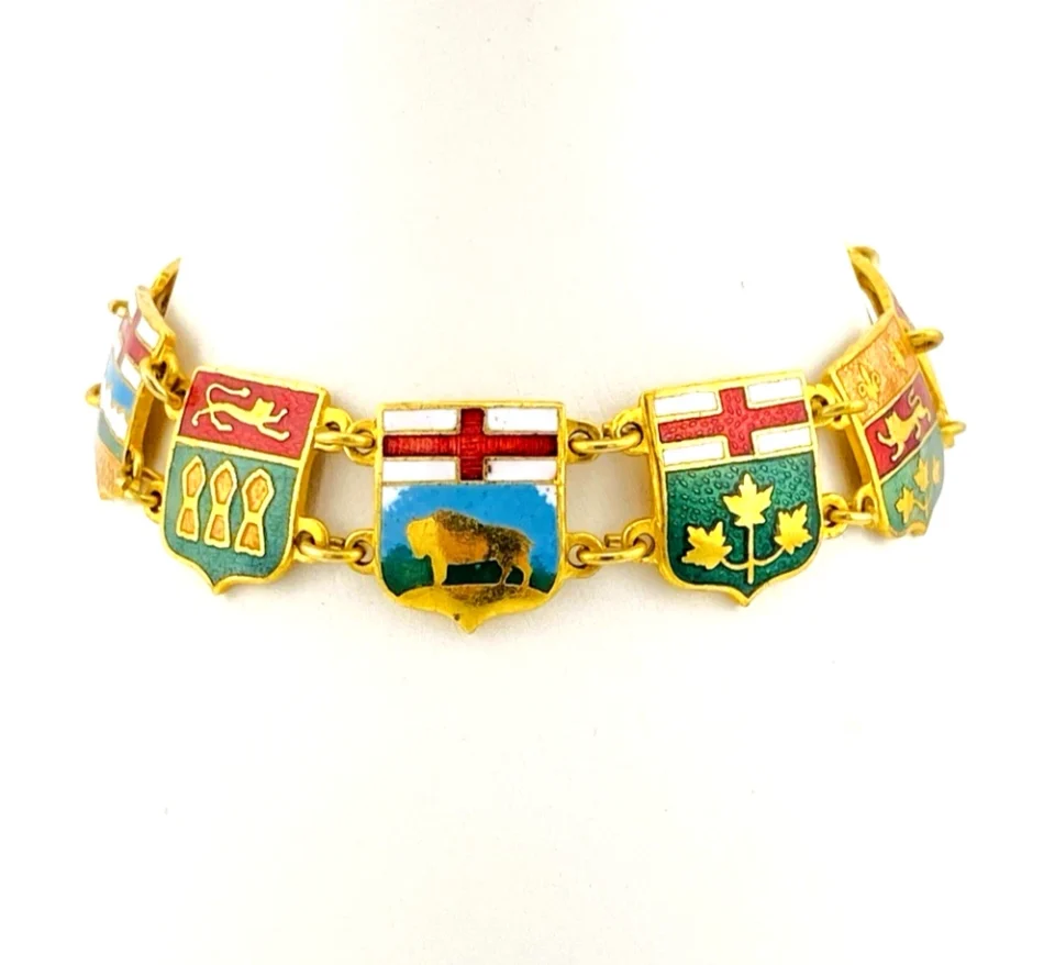 Vintage Canada souvenir bracelet with colorful enameled provincial shield links and gold plated finish