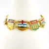 Vintage Canada souvenir bracelet with colorful enameled provincial shield links and gold plated finish