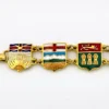 Vintage Canada souvenir bracelet with colorful enameled provincial shield links and gold plated finish