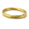 Vintage Carl Art 14k gold filled twisted rope hinged bangle bracelet with oval hollow form