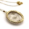 Gold rutilated quartz pendant necklace with oval cabochon and 12k rolled gold chain

8) Short Description