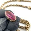 Gold filled repurposed pocket watch chain necklace with pink jeweled fob charm and mixed chain links