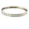 Vintage Beau Sterling silver bangle bracelet with stamped geometric pattern.