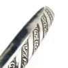 Vintage Danecraft sterling silver bangle bracelet with raised spiral rope design and carved scroll details.