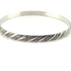 Vintage Danecraft sterling silver bangle bracelet with raised spiral rope design and carved scroll details.