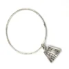 Hand wrought sterling silver studio bangle bracelet with trapezoid charm and organic stamped texture.