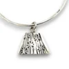 Hand wrought sterling silver studio bangle bracelet with trapezoid charm and organic stamped texture.