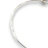 Hand wrought sterling silver studio bangle bracelet with trapezoid charm and organic stamped texture.