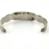 Vintage 1920s–1930s Navajo Fred Harvey era silver cuff bracelet with applied arrows, hand stamped motifs, and lizard-like markings.