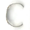 Vintage 1920s–1930s Navajo Fred Harvey era silver cuff bracelet with applied arrows, hand stamped motifs, and lizard-like markings.