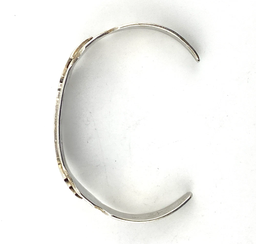 Vintage 1920s–1930s Navajo Fred Harvey era silver cuff bracelet with applied arrows, hand stamped motifs, and lizard-like markings.