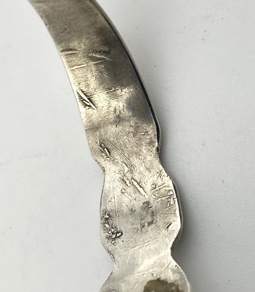 Vintage 1920s–1930s Navajo Fred Harvey era silver cuff bracelet with applied arrows, hand stamped motifs, and lizard-like markings.