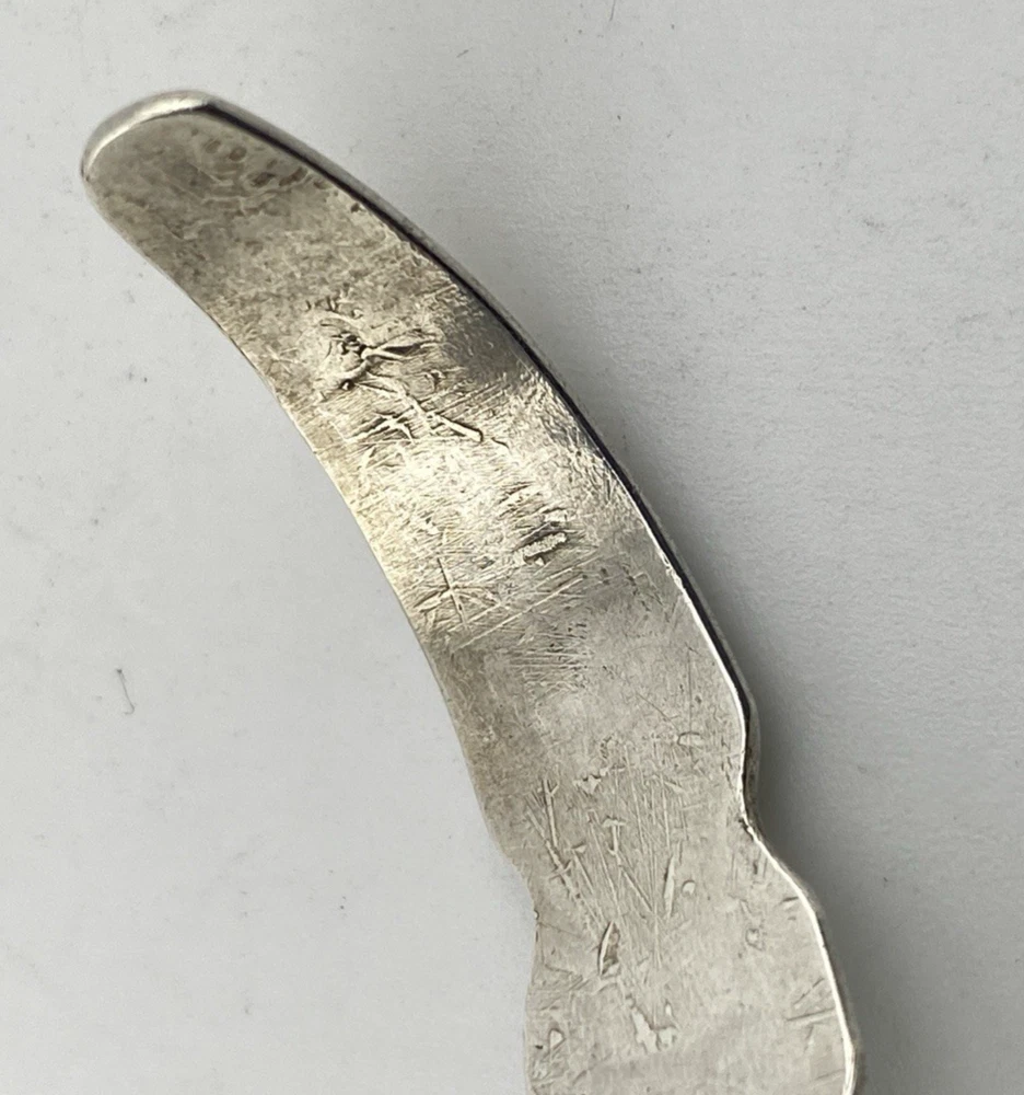 Vintage 1920s–1930s Navajo Fred Harvey era silver cuff bracelet with applied arrows, hand stamped motifs, and lizard-like markings.
