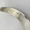 Vintage 1920s–1930s Navajo Fred Harvey era silver cuff bracelet with applied arrows, hand stamped motifs, and lizard-like markings.