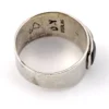 Vintage Southwestern sterling silver cigar band ring with turquoise, coral, black onyx, and mother of pearl inlay.