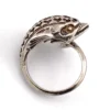 Vintage sterling silver dolphin bypass ring with carved figural details and dark patina.