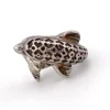 Vintage sterling silver dolphin bypass ring with carved figural details and dark patina.