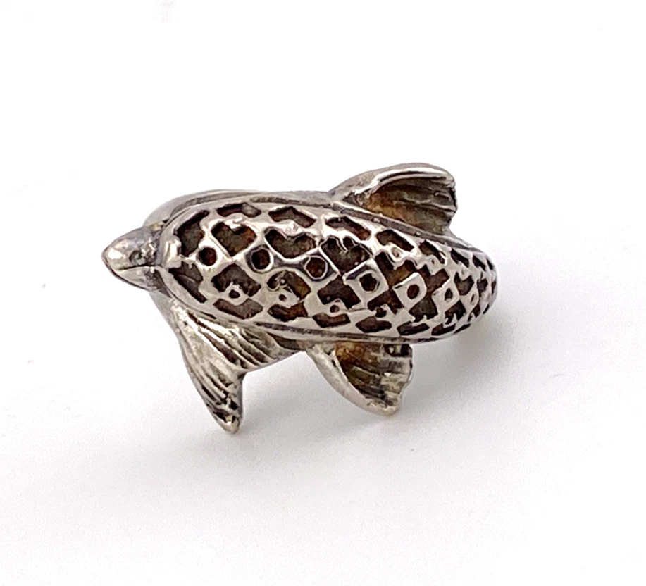 Vintage sterling silver dolphin bypass ring with carved figural details and dark patina.