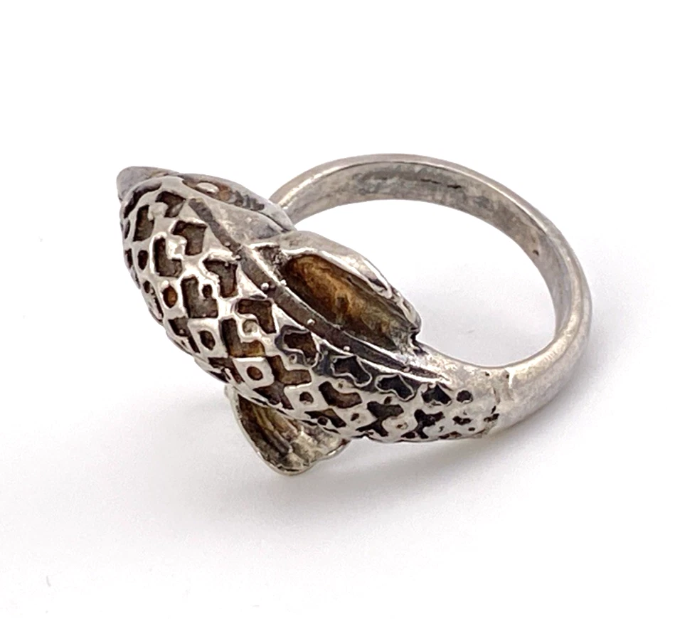 Vintage sterling silver dolphin bypass ring with carved figural details and dark patina.