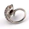 Vintage sterling silver dolphin bypass ring with carved figural details and dark patina.