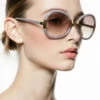 Vintage 1970s Ted Lapidus oversized gray butterfly sunglasses with gold accents and brown rose gradient lenses, handmade in France