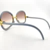 Gold tone hinge detail on Ted Lapidus sunglasses