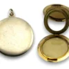 Vintage 1940s sterling silver round family locket by L&M with matte covers, gold washed interior, patent applied for mark, and multiple photo compartments