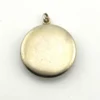 Vintage 1940s sterling silver round family locket by L&M with matte covers, gold washed interior, patent applied for mark, and multiple photo compartments