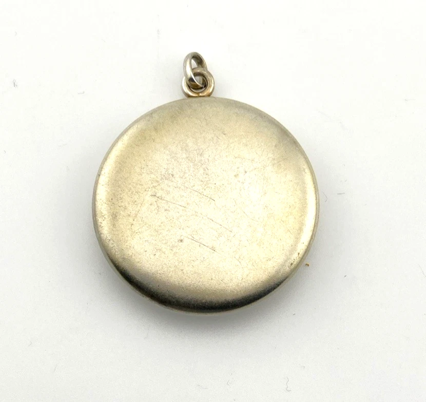 Vintage 1940s sterling silver round family locket by L&M with matte covers, gold washed interior, patent applied for mark, and multiple photo compartments