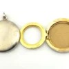 Vintage 1940s sterling silver round family locket by L&M with matte covers, gold washed interior, patent applied for mark, and multiple photo compartments