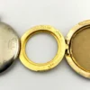 Vintage 1940s sterling silver round family locket by L&M with matte covers, gold washed interior, patent applied for mark, and multiple photo compartments