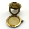 Vintage 1940s sterling silver round family locket by L&M with matte covers, gold washed interior, patent applied for mark, and multiple photo compartments