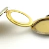 Vintage 1940s sterling silver round family locket by L&M with matte covers, gold washed interior, patent applied for mark, and multiple photo compartments