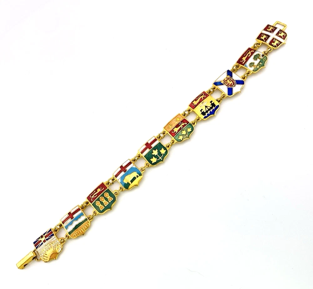 Vintage Canada souvenir bracelet with colorful enameled provincial shield links and gold plated finish