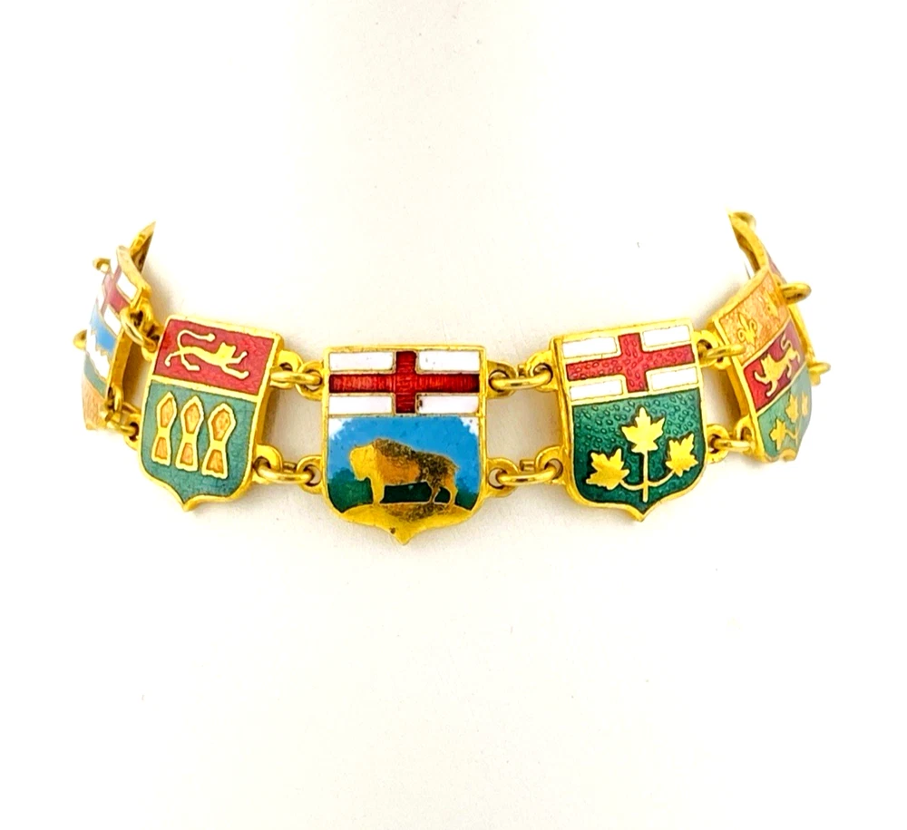 Vintage Canada souvenir bracelet with colorful enameled provincial shield links and gold plated finish