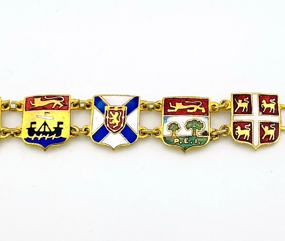 Vintage Canada souvenir bracelet with colorful enameled provincial shield links and gold plated finish