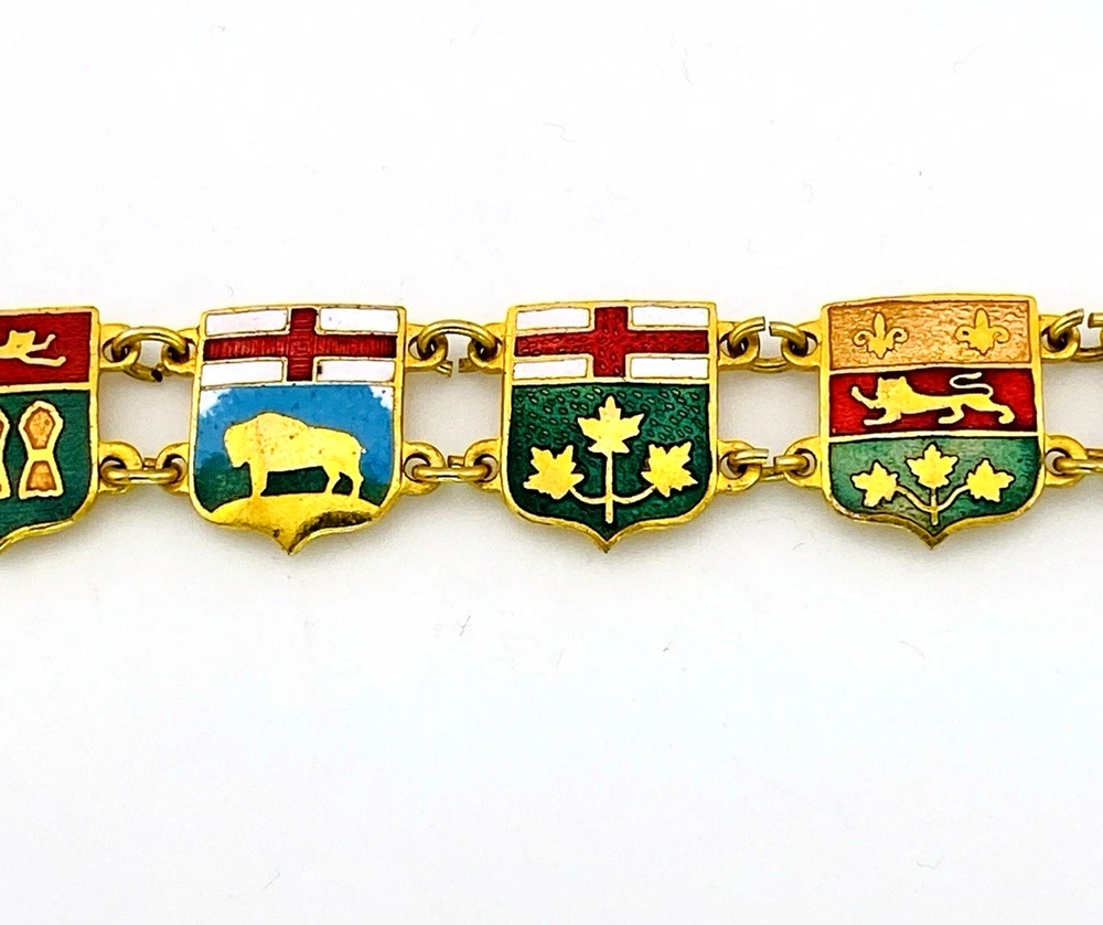 Vintage Canada souvenir bracelet with colorful enameled provincial shield links and gold plated finish