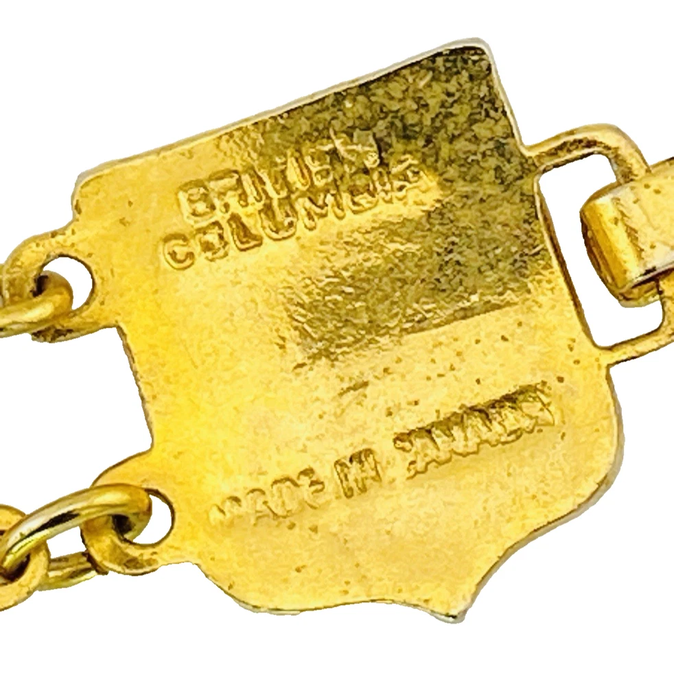 Vintage Canada souvenir bracelet with colorful enameled provincial shield links and gold plated finish