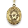 Vintage F.M. Co 1/20 10K gold filled oval locket necklace with hand engraved floral center, raised frame, and 19.5 inch chain