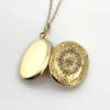 Vintage F.M. Co 1/20 10K gold filled oval locket necklace with hand engraved floral center, raised frame, and 19.5 inch chain
