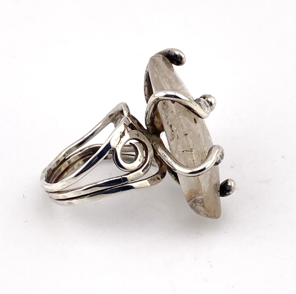 Vintage Modernist Brutalist sterling silver studio ring with a large tumbled amethyst pebble and hand wrought scroll setting.