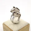 Vintage Modernist Brutalist sterling silver studio ring with a large tumbled amethyst pebble and hand wrought scroll setting.