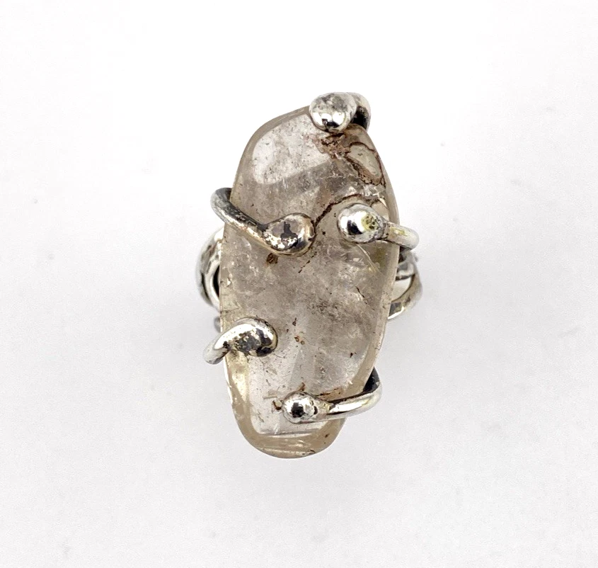 Vintage Modernist Brutalist sterling silver studio ring with a large tumbled amethyst pebble and hand wrought scroll setting.