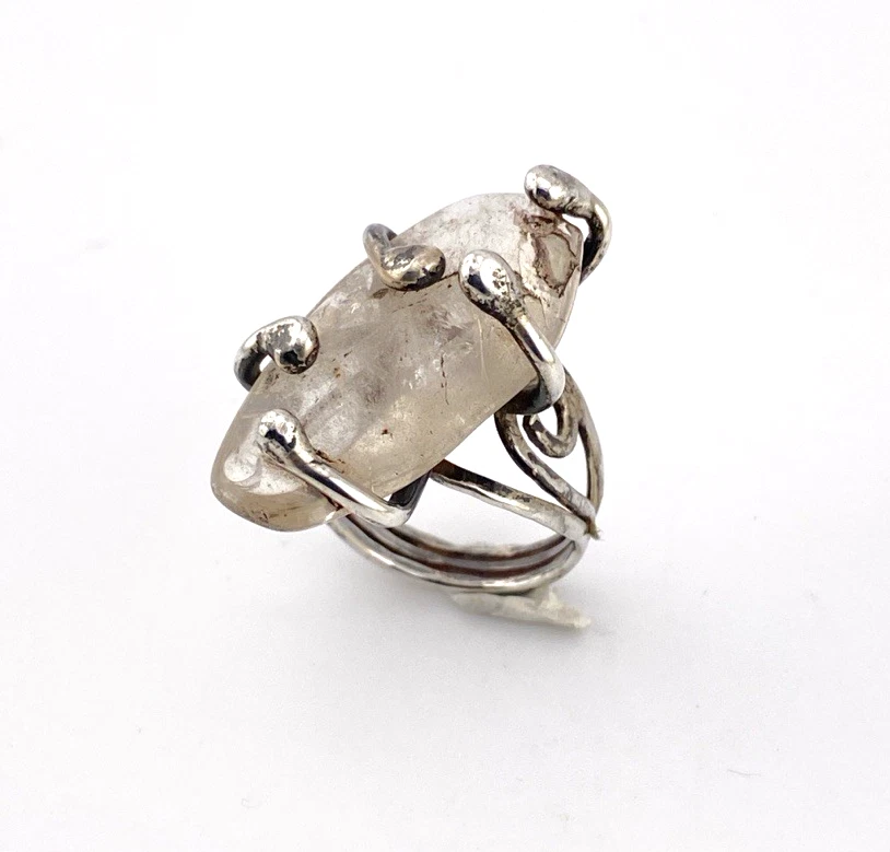 Vintage Modernist Brutalist sterling silver studio ring with a large tumbled amethyst pebble and hand wrought scroll setting.