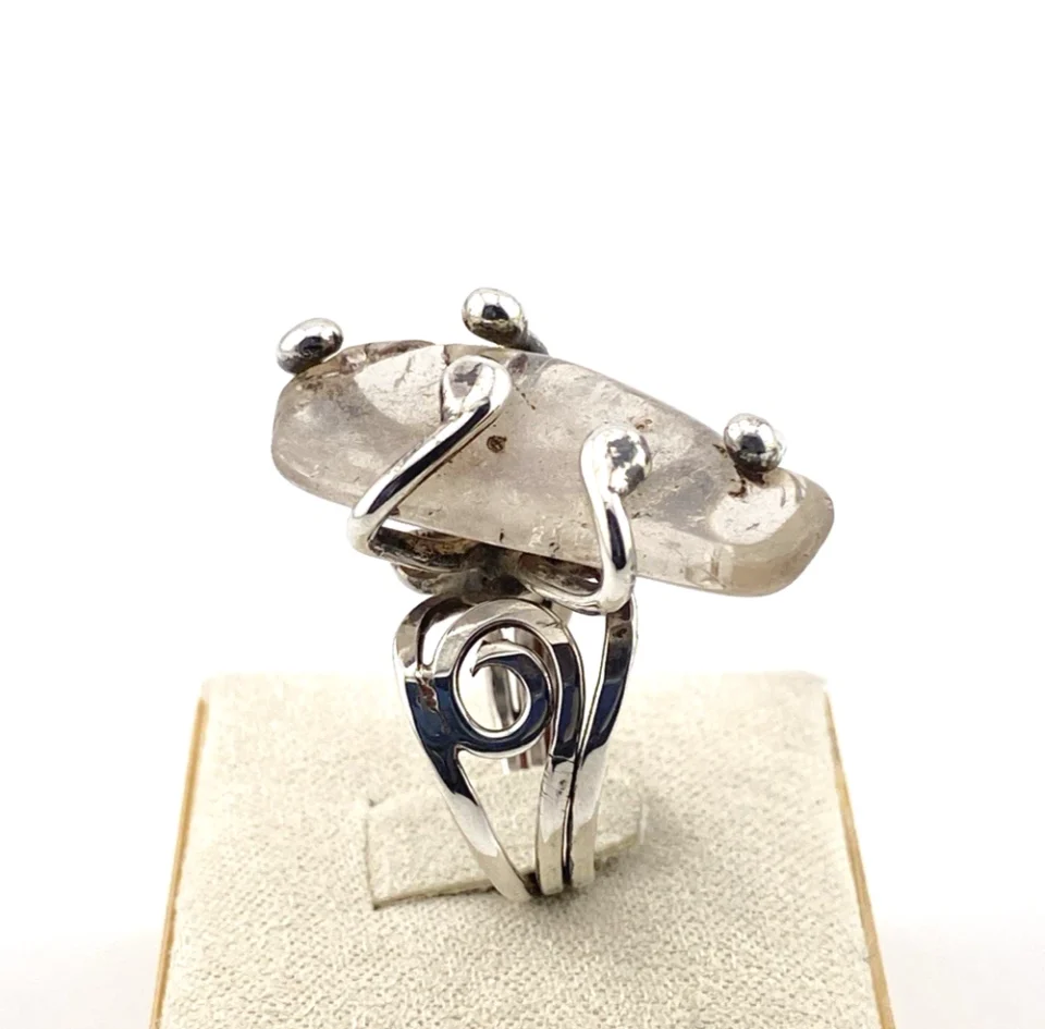 Vintage Modernist Brutalist sterling silver studio ring with a large tumbled amethyst pebble and hand wrought scroll setting.