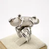 Vintage Modernist Brutalist sterling silver studio ring with a large tumbled amethyst pebble and hand wrought scroll setting.