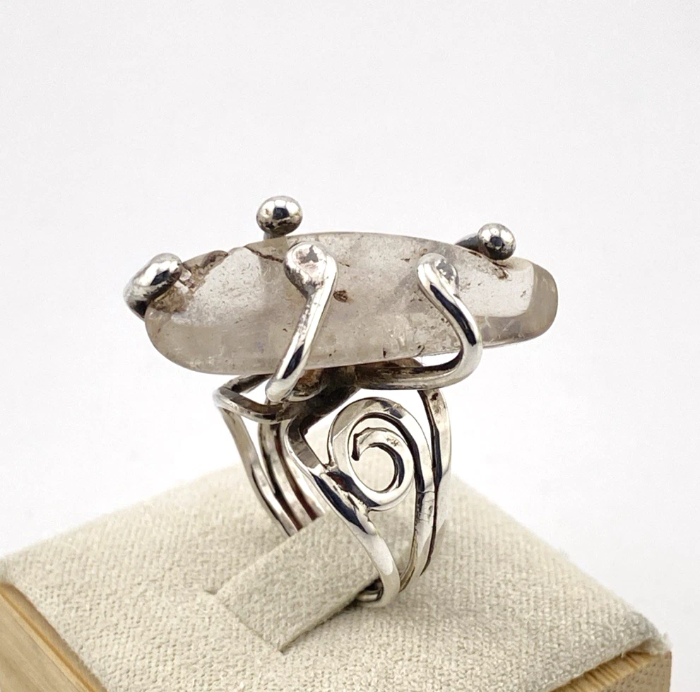 Vintage Modernist Brutalist sterling silver studio ring with a large tumbled amethyst pebble and hand wrought scroll setting.